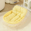 Yellow pastel pet nest with a padded base, raised sides and decorative lace trim.